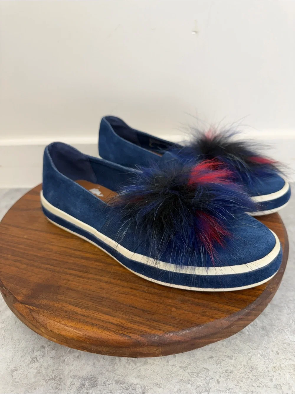 Sondra Roberts Navy Slip-On Sneakers with Red and Black Faux-Fur Poms‎